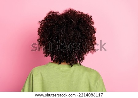 Rear back behind view portrait of attractive wavy-haired girl modern haircut isolated over pink pastel color background Royalty-Free Stock Photo #2214086117
