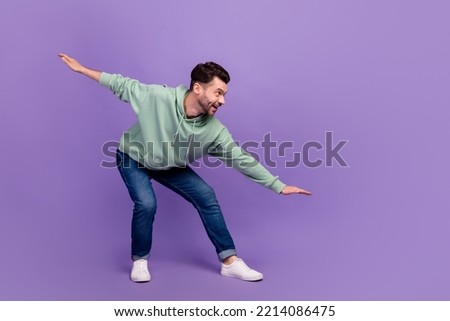 Side profile photo of youngster man taking balance interested excited looking empty space information about opening gym isolated on violet color background Royalty-Free Stock Photo #2214086475