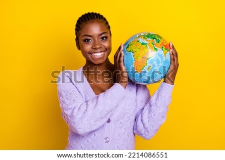 Portrait of nice cheerful girl hands hold globe beaming smile isolated on yellow color background Royalty-Free Stock Photo #2214086551