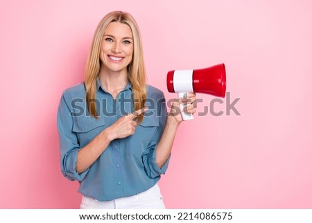 Photo of young adorable nice cute blonde hair woman positive smile finger directing protest inflation loudspeaker isolated on pink color background Royalty-Free Stock Photo #2214086575