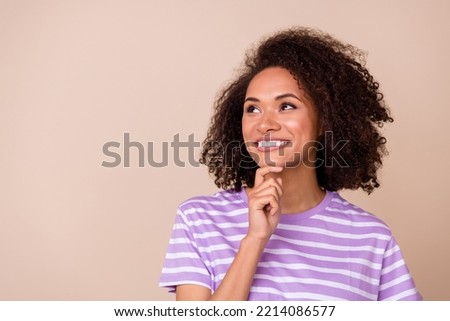 Closeup photo of young attractive nice woman toothy smile touch chin look empty space new advert shopping deal isolated on beige color background