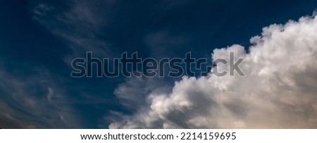 expressive clouds in a dark blue sky