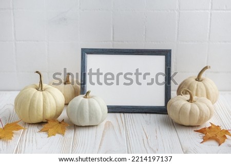 Interior design with autumn fall decor and picture frame mockup. Thanksgiving, Halloween holiday poster concept.