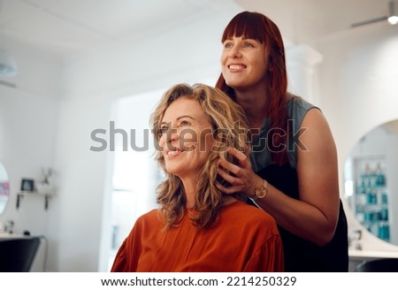 Hairdresser, senior woman client and hair care consultation with young hairstylist in training. Happy customer, stylish hairstyle cosmetic treatment and luxury beauty salon professional worker Royalty-Free Stock Photo #2214250329