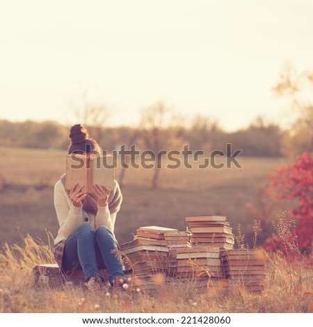 Girl with books Royalty-Free Stock Photo #221428060