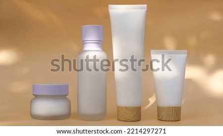 bottles for cosmetics made of plastic and glass stand on beige background. soft light, sun glare, close-up. blank for designers, cosmetics mockup for advertising, advertising layout