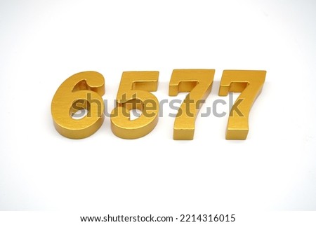    Number 6577 is made of gold-painted teak, 1 centimeter thick, placed on a white background to visualize it in 3D.                               