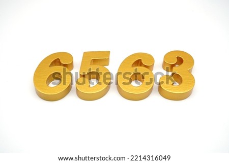  Number 6563 is made of gold-painted teak, 1 centimeter thick, placed on a white background to visualize it in 3D.                                