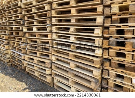 Lots of wooden pallets. Stacks of pallets.