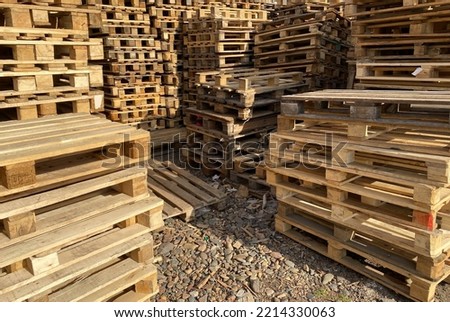 Lots of wooden pallets. Stacks of pallets.