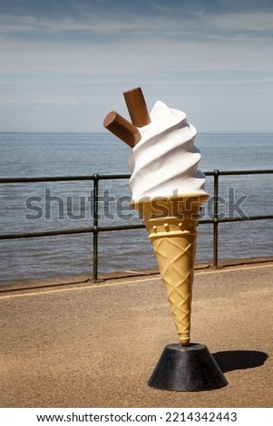 large model of a ice cream cone along the seaside Royalty-Free Stock Photo #2214342443