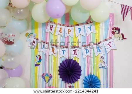 colorful birthday decoration idea for baby girl with Happy Birthday stick on background
