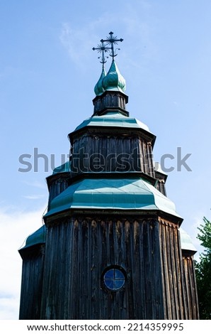 Ancient wooden church of St. Michael in the park of architecture Pirogovo and life of Ukraine
Vertical shot of an old tower building under a cloudy sky