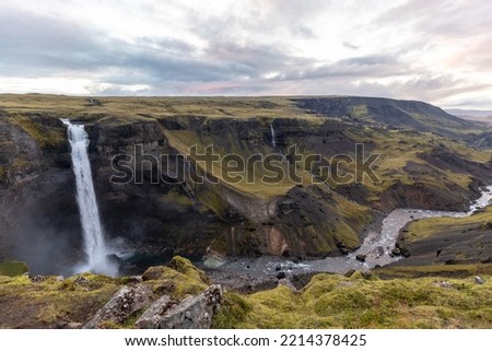 Beautiful waterfall in the forest Royalty-Free Stock Photo #2214378425