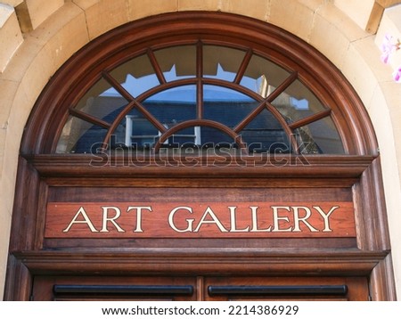 Art gallery entrance and sign close-up detail.