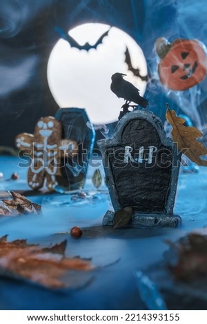 Close up of a tombstone in a cemetery. Copy space. Scary cemetery in fog at night by the light of the moon, crows, bats. Rising from the dead zombies. Halloween background. R.I.P text