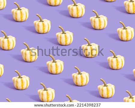 Pattern made of white with yellow lines pumpkin on purple colored background. Minimal autumn concept. Creative fall idea. Season of pumpkin in October.