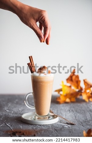 Spicy latte with pumpkin and whipped cream