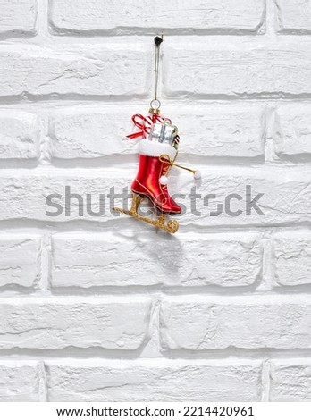 Christmas ice skate with decoration hanging on a wall