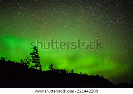 Aurora with meteor streaking above