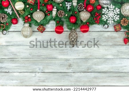 CHRISTMAS BACKGROUND WITH ORNAMENTS AND DECORATIONS ON WHITE WOODEN PLANKS. FOCUS SELECTED. COPY SPACE.
