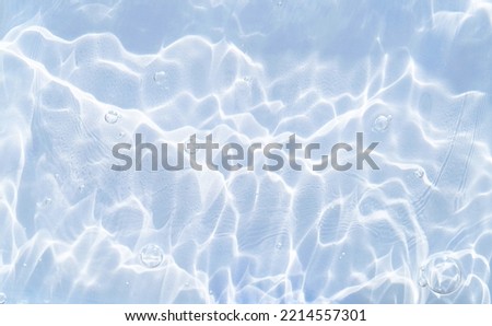An original beautiful background image for creative work or design in form of water surface with chaotic waves and beautiful light reflections.
