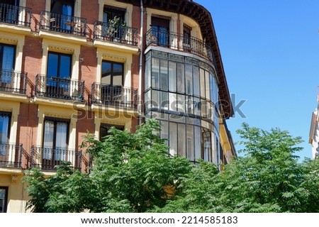 Rounded corner of old classical building in Anton Martin neighbourhood, centre of Madrid, Spain.