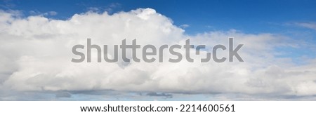 Ornamental clouds. Dramatic sky. Epic storm cloudscape. Soft sunlight. Panoramic image, texture, background, graphic resources, design, copy space. Meteorology, heaven, hope, peace concept