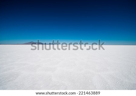 Salt Flats in Utah. Salt Flats Landscape. Dark Blue Sky and Snow White Salt Soil. Boneville near Salt Lake City, Utah, United States. Bonneville Salt Flats Royalty-Free Stock Photo #221463889