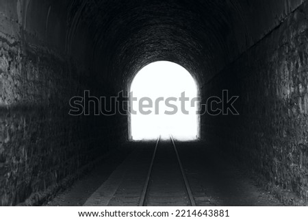 Day light at the end of the tunnel. Abstract background. Concept of hope or goal of life.  dark old railway tunnel toward bright light in the end