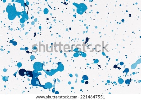 Blue drops paint texture background blue color on white paper. Brush stroke. Hand made