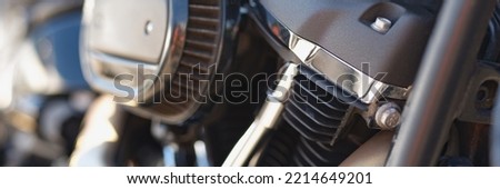 Part of a motorcycle in detail, close-up, blurry Royalty-Free Stock Photo #2214649201