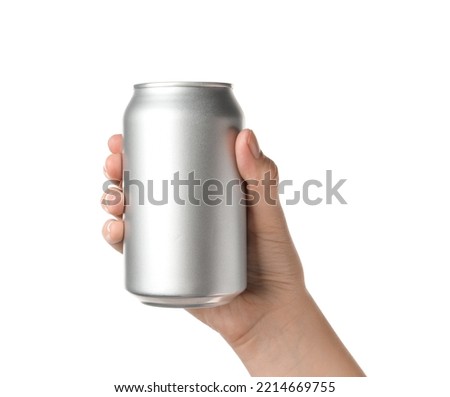 Woman holding aluminum can on white background, closeup Royalty-Free Stock Photo #2214669755