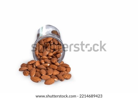 Dried almond nuts closeup isolated on white background. Stock photo of healthy food ingredients