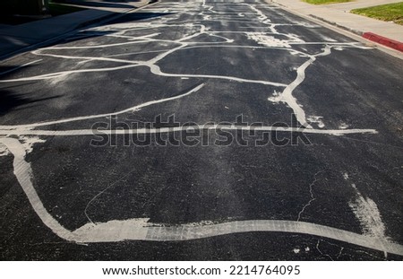 Street prepared for asphalt slurry resurfacing  Royalty-Free Stock Photo #2214764095