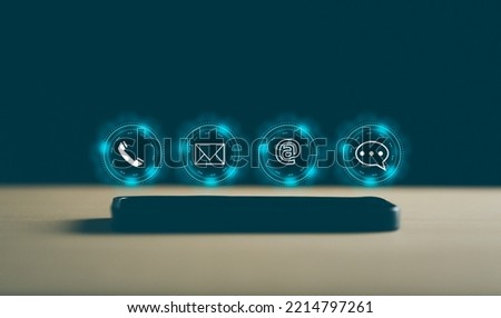 concept, Customer support hotline Contact us people connection. email, call phone, address, Chat message icons. on smartphone. Royalty-Free Stock Photo #2214797261