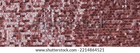 Rectangular red shiny fabric with sequins. Burgundy fabric and bright texture concept