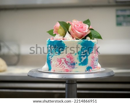 birthday pastel frosted cup cake with topping natural real roses and turquoise deco