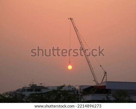 Sunset view with cranes working on construction site in city, amazing image, art picture