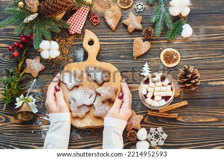 Woman decorating the table. Christmas background.