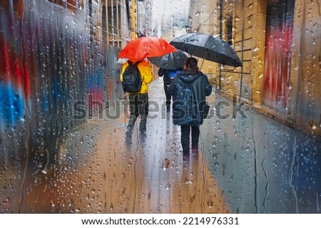 people with an umbrella in raining days, bilbao, basque country, spain