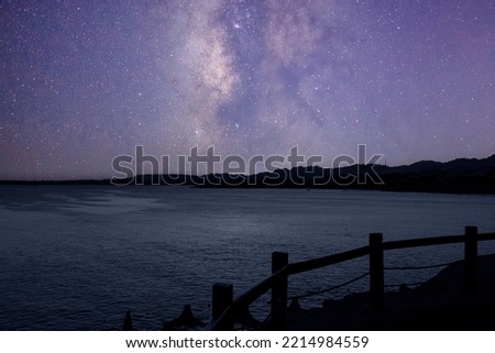 Night landscape, Red Sea and Sinai Mountains against the background of the night sky with stars and the Milky Way. Sinai peninsula.