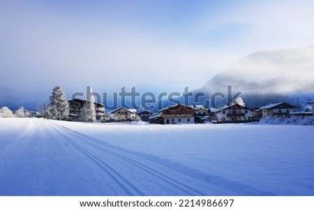 Cross-country skiing track in the morning sun, St. Johann in Tyrol, Austria	
 Royalty-Free Stock Photo #2214986697