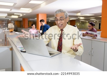 Businessman using laptop at office