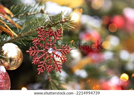 Christmas background of a Christmas tree decorated with Christmas toys. Winter holidays. New Year