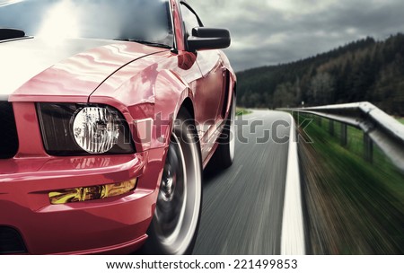 Red sport car Royalty-Free Stock Photo #221499853