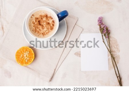 wedding, business and finance card concept. cappuccino coffee and blank paper. mockup. Top view.