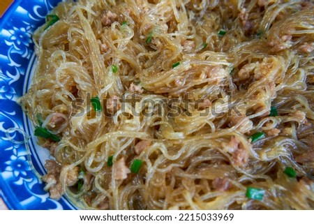 A delicious Chinese dish, fried rice noodles with minced meat, the name of the dish is ants on the tree