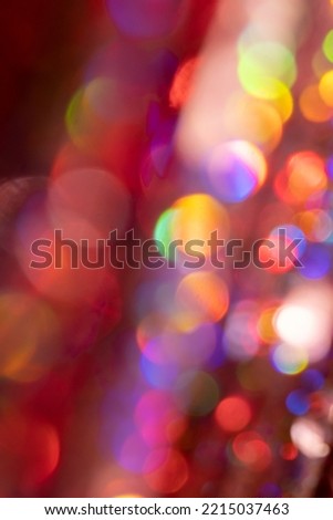 Festive Happy New Year and Merry Christmas background with colorful bright bokeh.