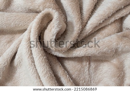 Brown fur background. Synthetic fur brown texture for the background. Texture faux fur fiber blanket rug.